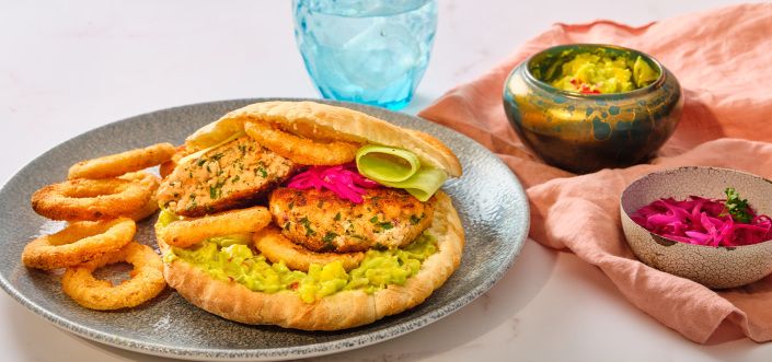 Burger with salmon, avocado and mango salsa and AVIKO Onion Rings
