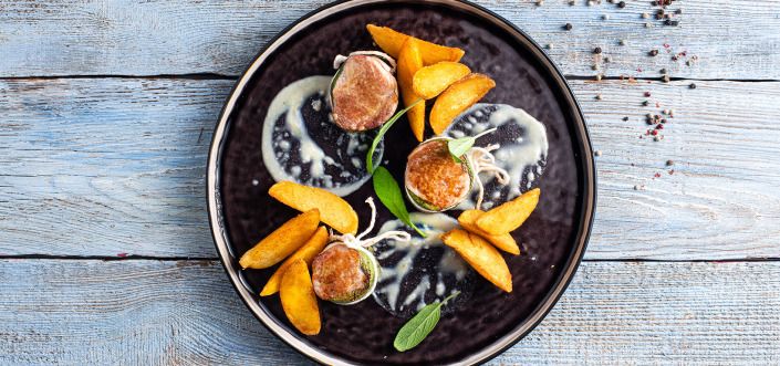 Pork tenderloin medallions with cheese sauce served with AVIKO Pati Parts Tex Mex