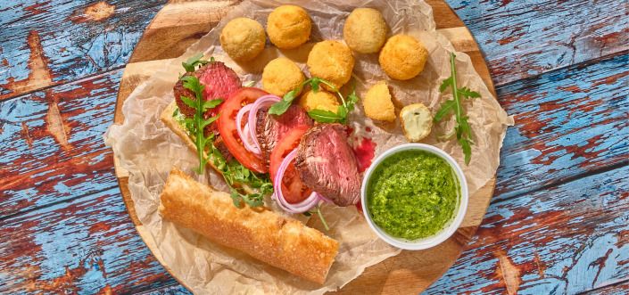 Sandwich with steak, green harissa and mayonnaise sauce and AVIKO Jalapeño Balls