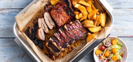 Ribs marinated in salsa BBQ sauce with salad, coriander and sour cream served with spicy AVIKO Pati Parts Tex Mex